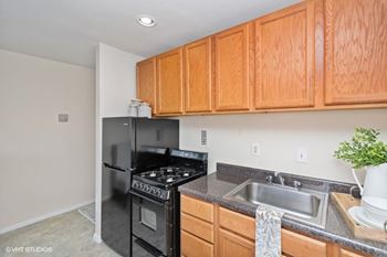 Kitchens with new appliances, counters, sinks and flooring